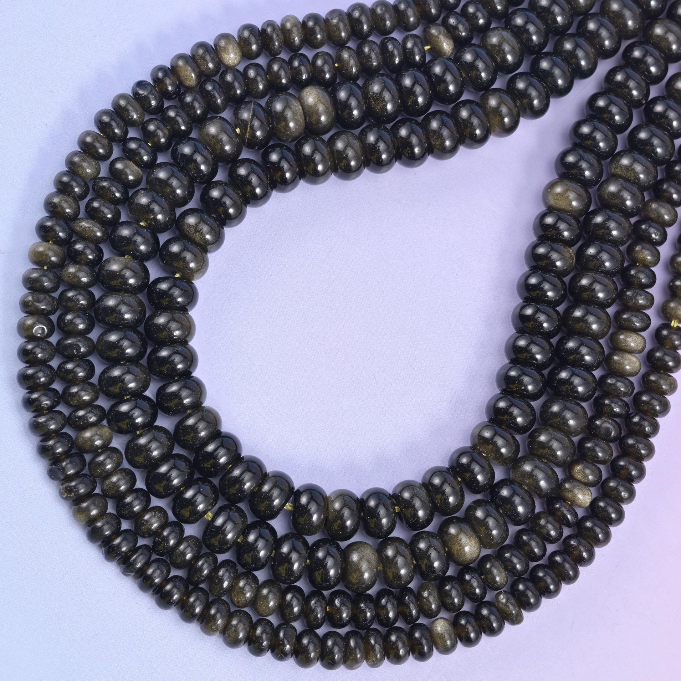 Gold Obsidian rondelle beads, approximately 90 beads per strand