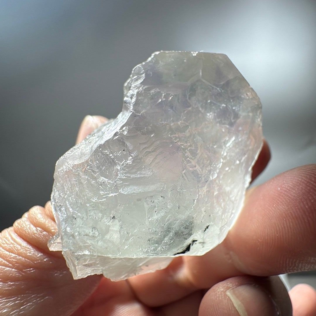 Rear face of the fluorite specimen with a frosted, naturally broken edge