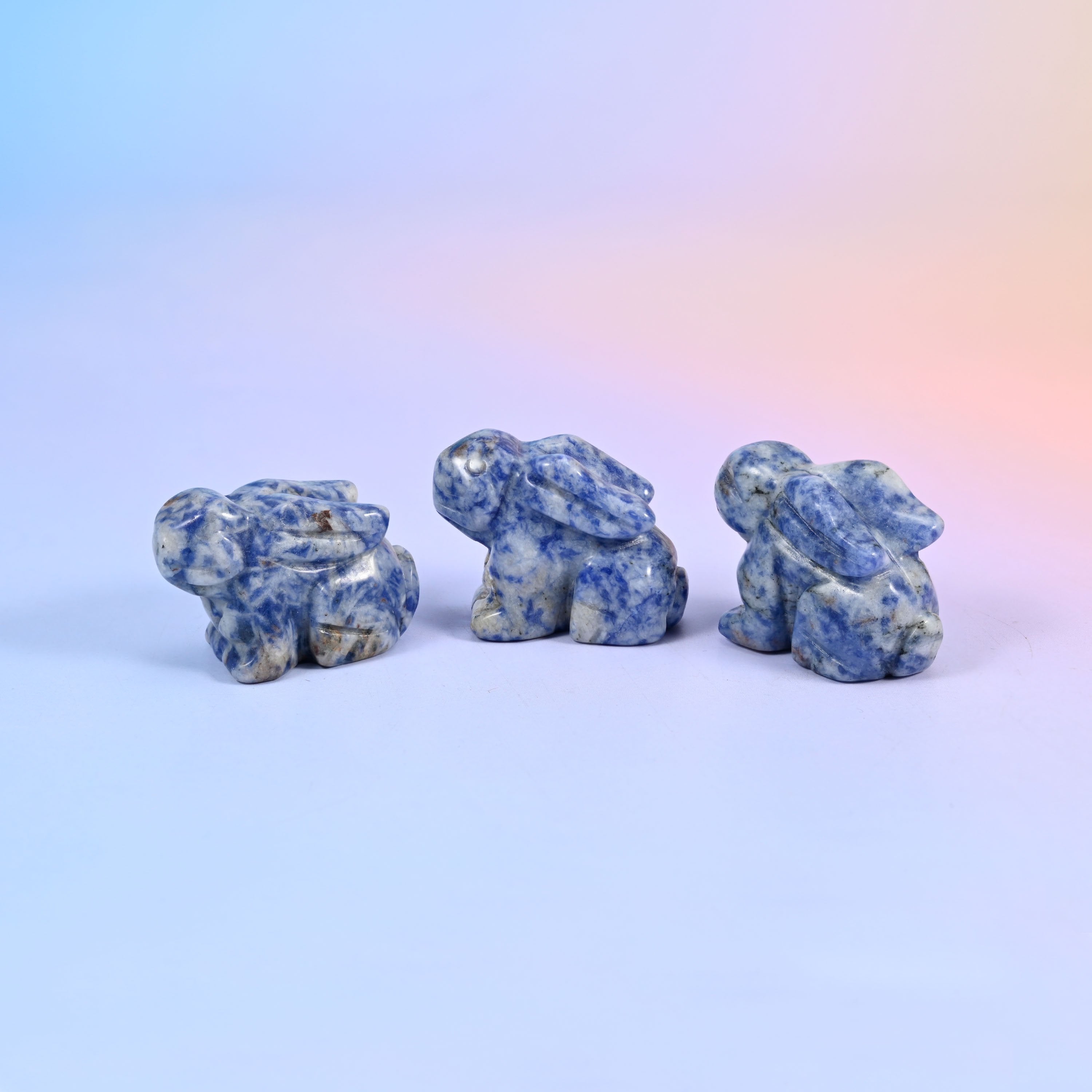 Laying down bunny carving offered in 47 gemstones, from deep green and cream to lilac, coral and blue