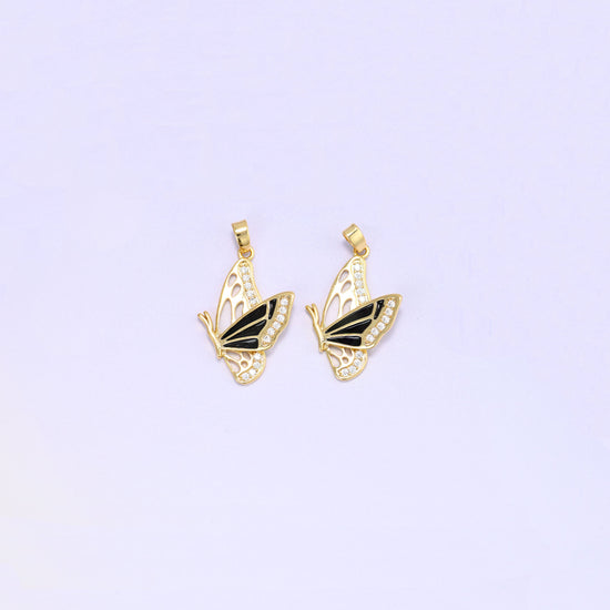 Black colourway of the flying butterfly charm pendant, a pair of gold plated charms with black enamel wings and clear zirconia set along the wing edges.