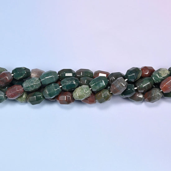Close-up circular coil of Indian Agate faceted barrel beads, showing the green and rust red color variation.