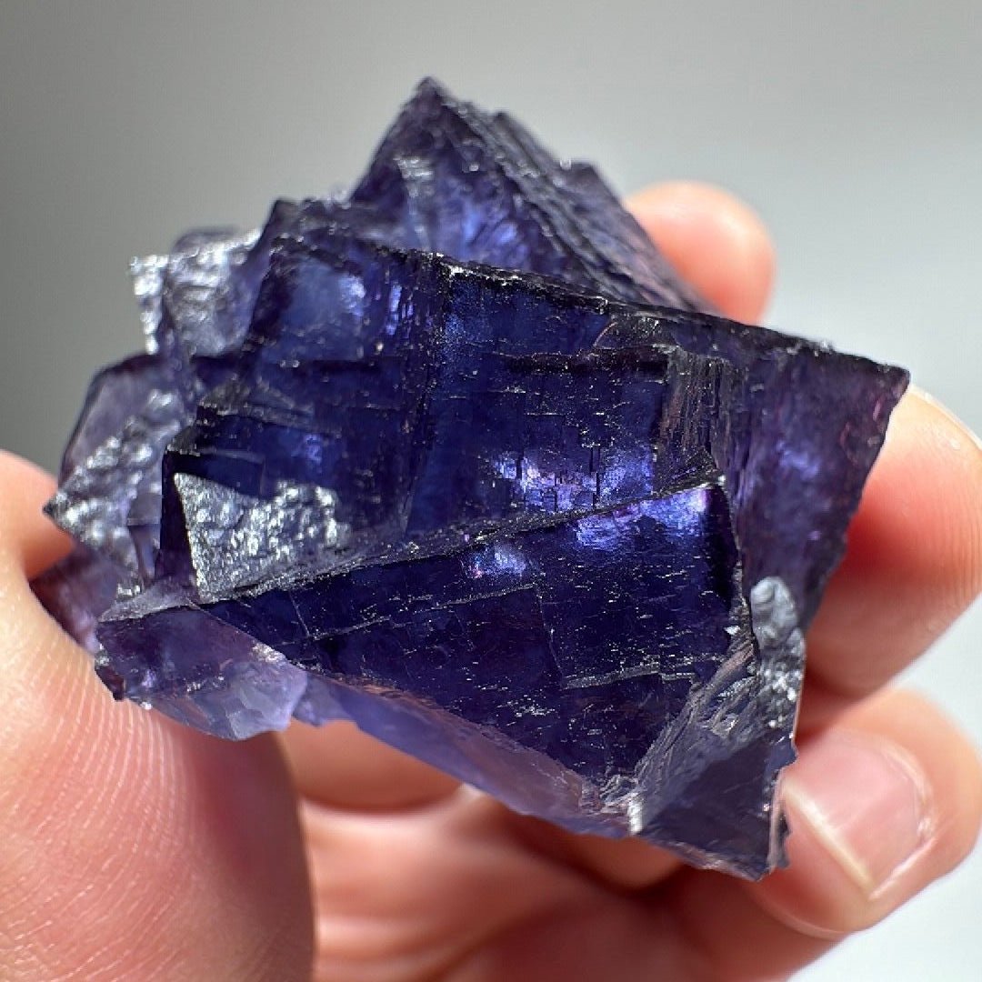 Purple blue cubic Fluorite specimen, interlocking stepped cubes in deep violet-blue