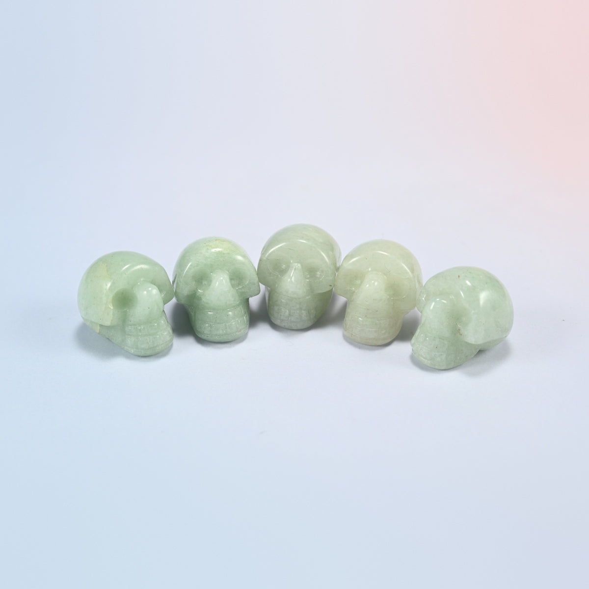 1 inch skull crystal carving in green aventurine, soft green natural stone