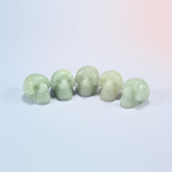 1 inch skull crystal carving in green aventurine, soft green natural stone