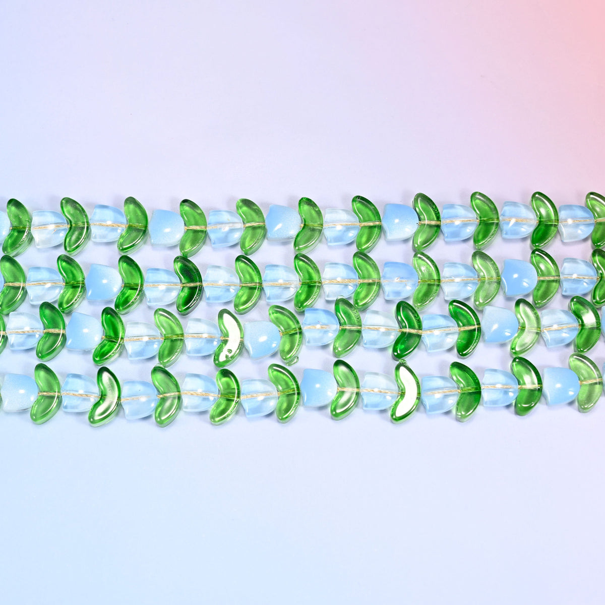 Light Blue Tulip Flower Glass Beads in light blue and opal-toned flowers with green leaves