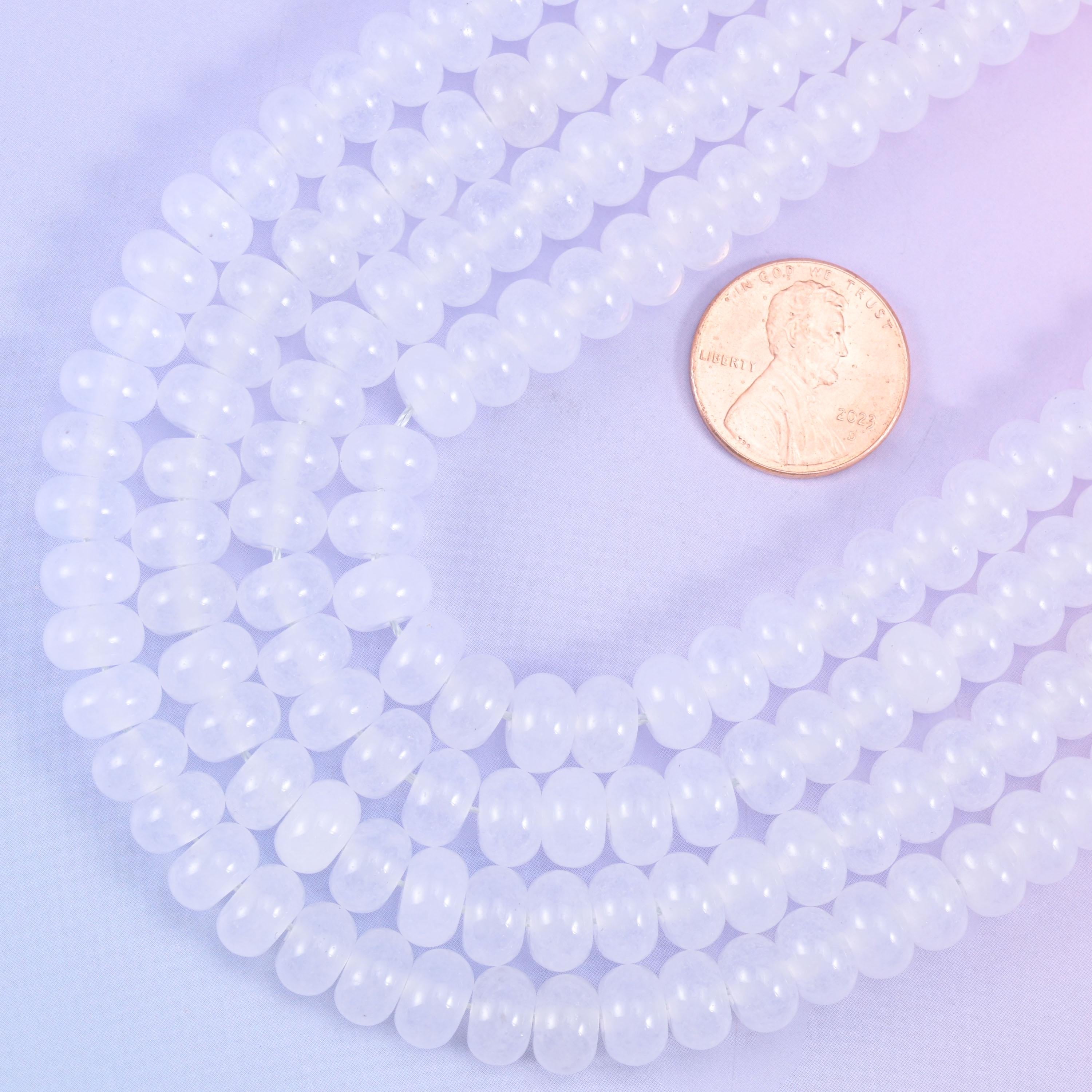 Smooth rondelle cut dyed jade beads with a polished surface