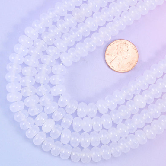Smooth rondelle cut dyed jade beads with a polished surface