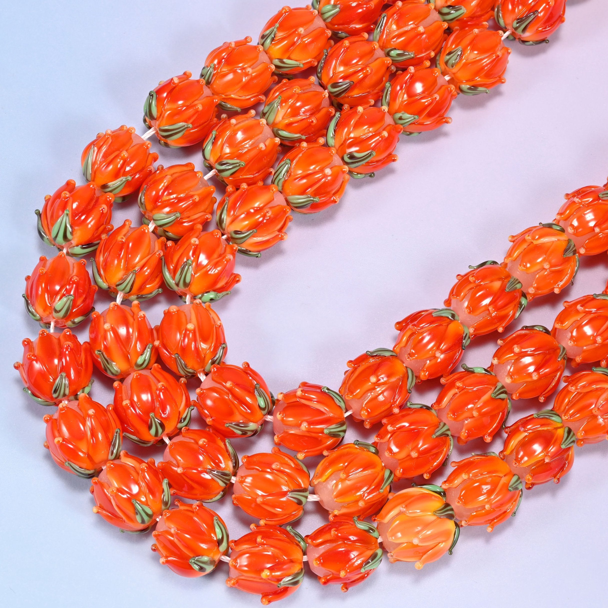 Orange tulip flower bud lampwork glass beads, 11 inch strand