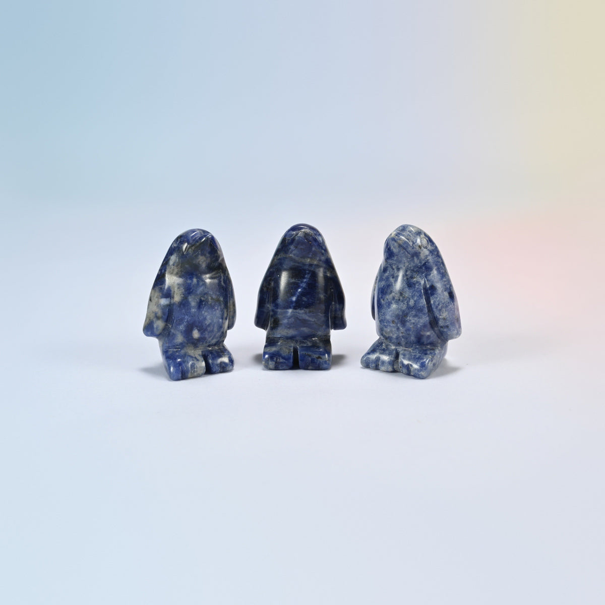 Three sodalite penguin crystal carvings, 1.5 inch, deep blue natural stone with white veins
