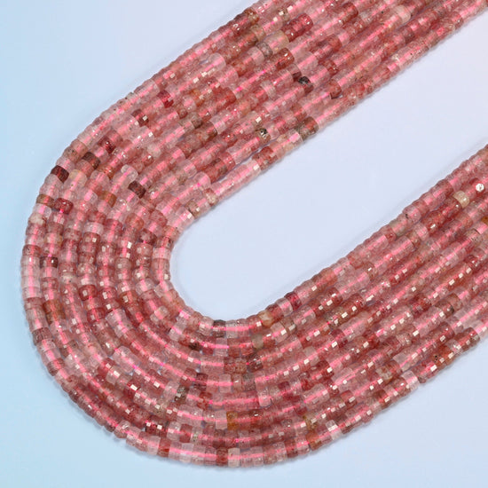 Strawberry quartz faceted heishi disc beads in several strands curved into a wide U, pink and clear stone with red flecks