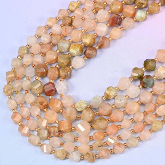 Red Grass Silk Stone faceted spiral twist beads, 15 inch strand