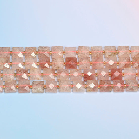 Several strands of natural strawberry quartz faceted flat square beads laid in straight rows