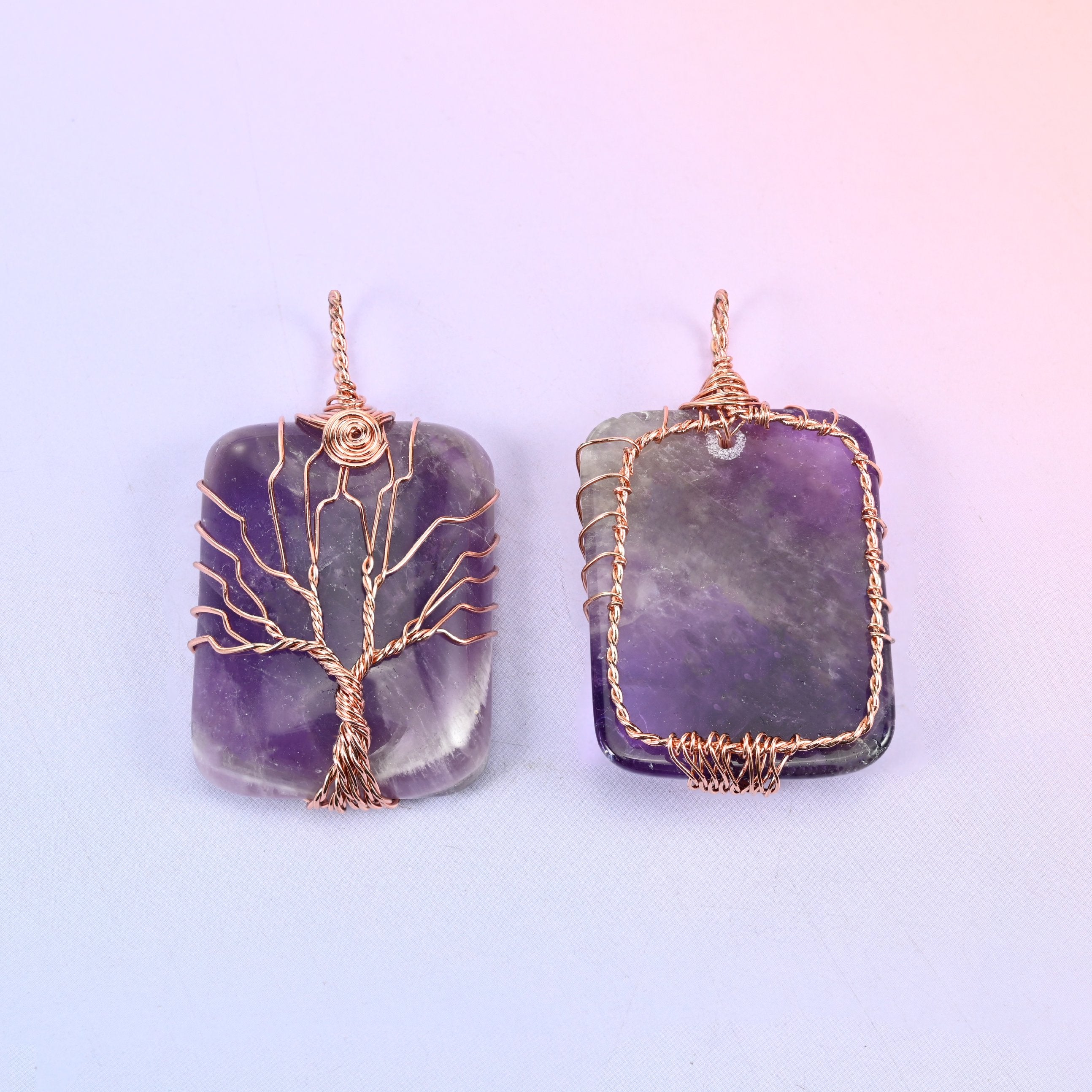Rectangle Gemstone Tree of Life Pendant in purple, front and back together, the reverse framed by an open copper wire border that leaves the stone visible.
