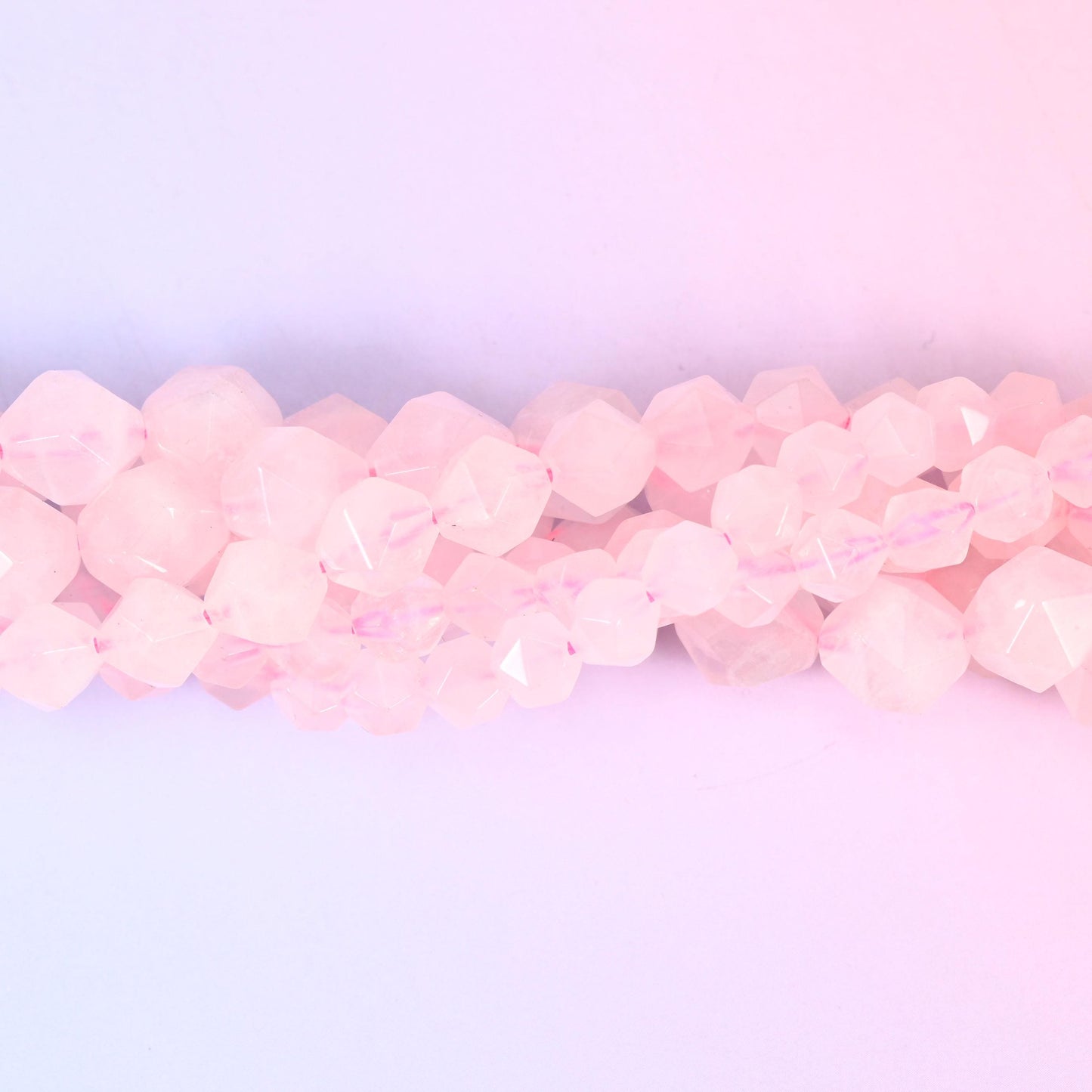 Natural Rose Quartz gemstone beads with a faceted star cut