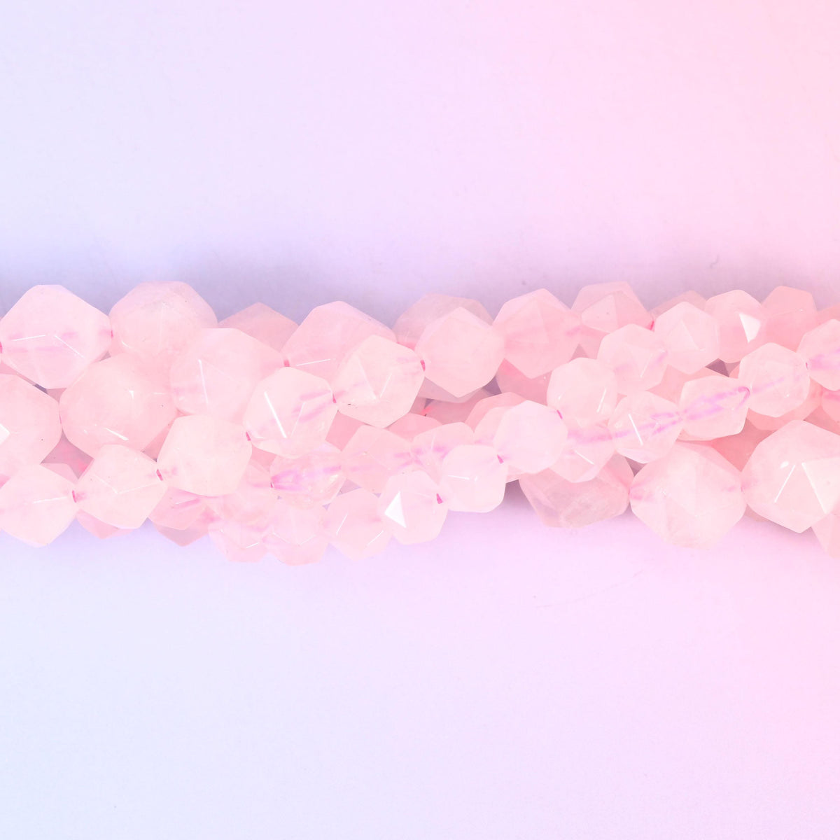 Natural Rose Quartz gemstone beads with a faceted star cut