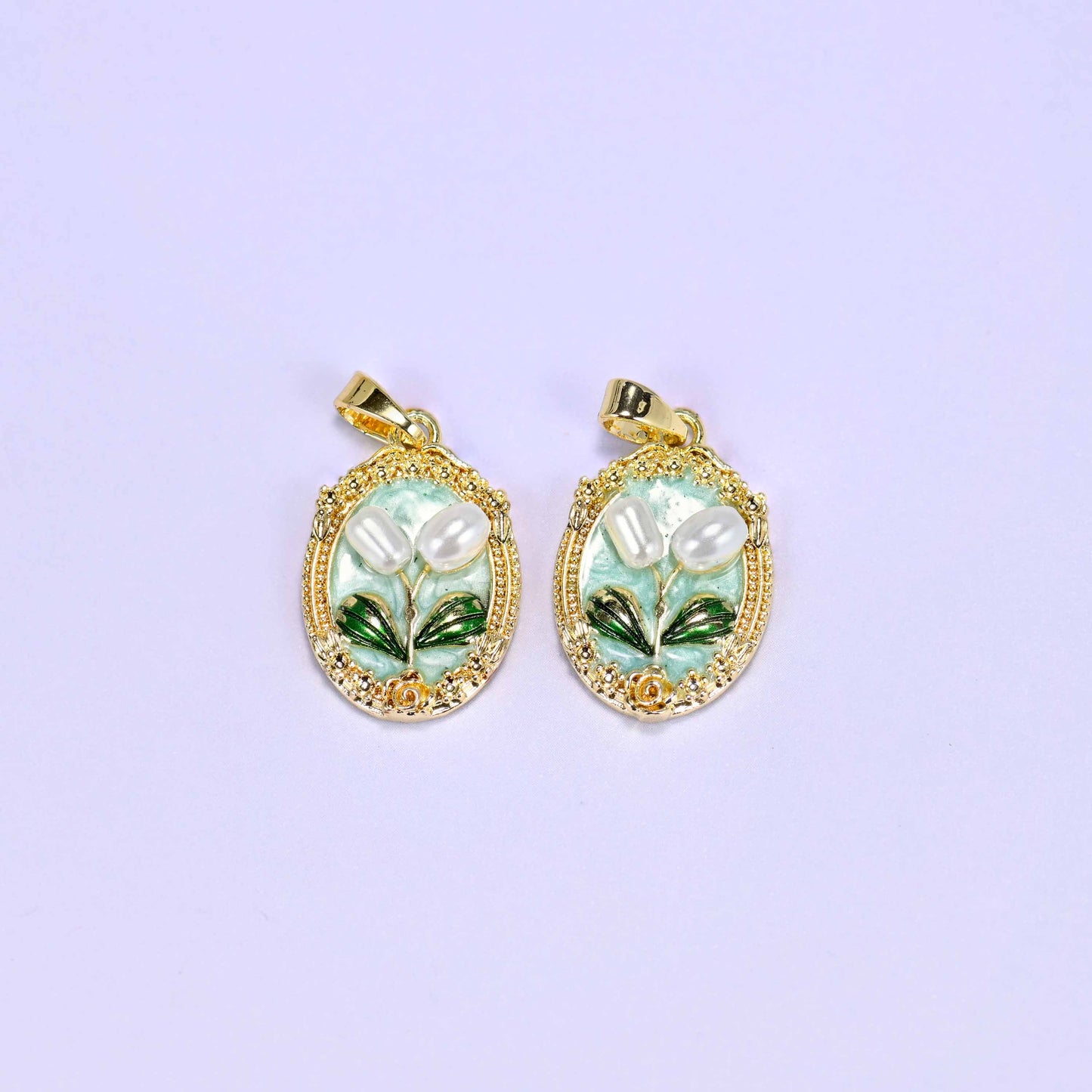 Enamel Oval Tulip Flower Pendants in mint, a matched pair with white faux pearl tulips and green leaves inside an ornate gold oval.