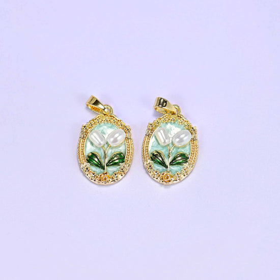 Enamel Oval Tulip Flower Pendants in mint, a matched pair with white faux pearl tulips and green leaves inside an ornate gold oval.