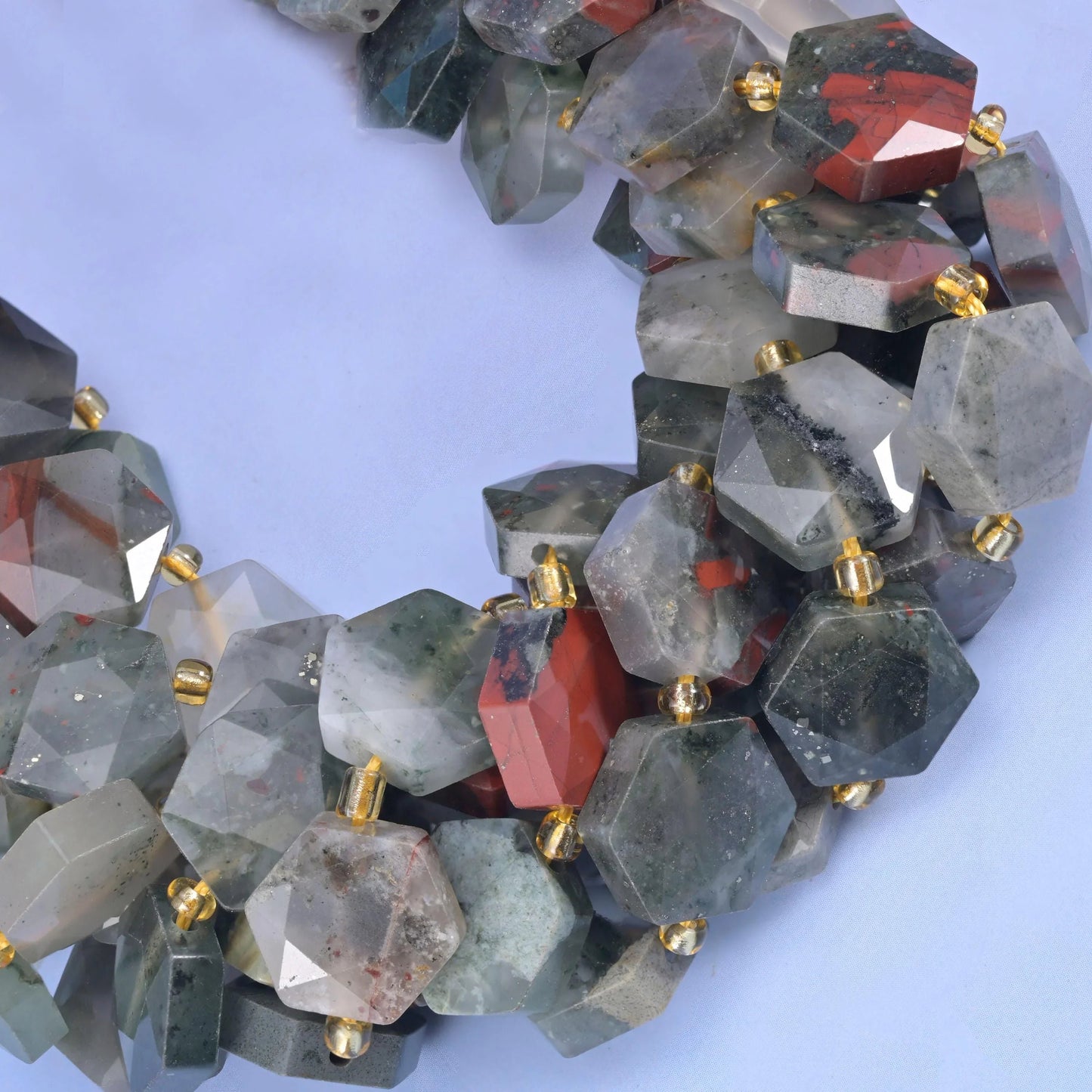 Close curve of African Bloodstone hexagons with translucent pale quartz zones