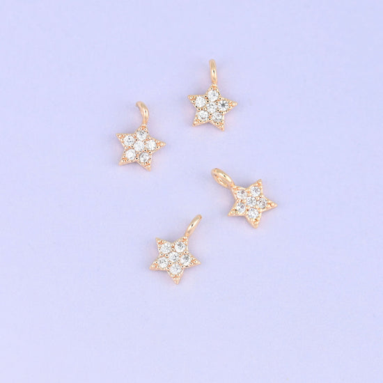 Small gold charms, four gold plated star charms with clear cubic zirconia