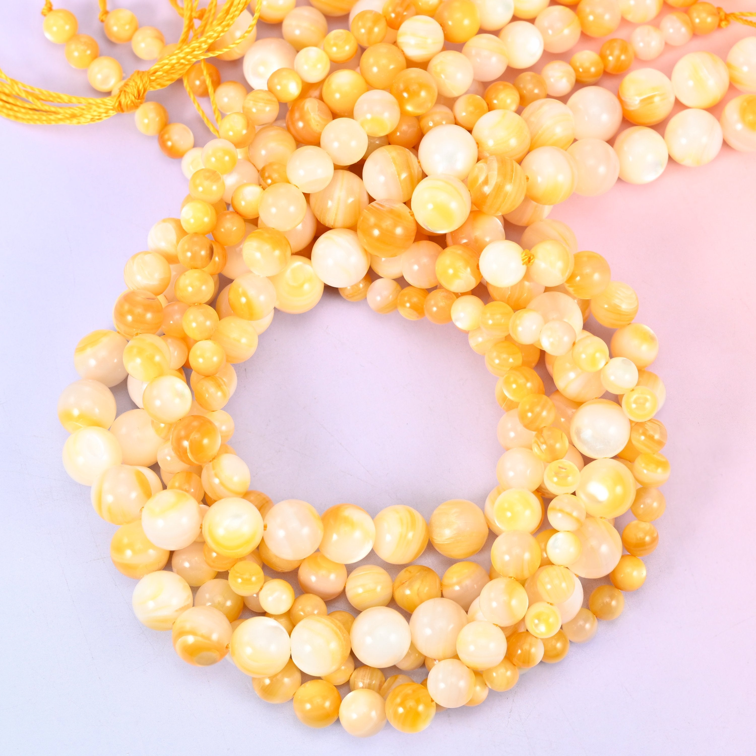 Yellow Pearl Shell Round Beads, sold per 14 inch strand