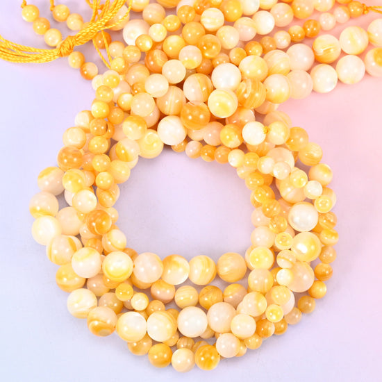 Yellow Pearl Shell Round Beads, sold per 14 inch strand