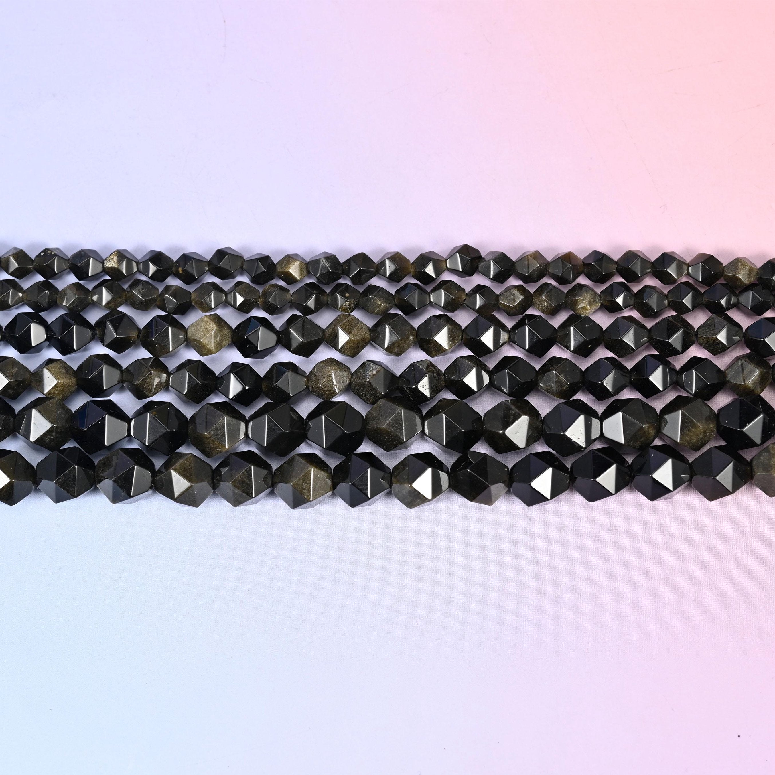 Gold Obsidian in near-black stone with a warm bronze-gold sheen