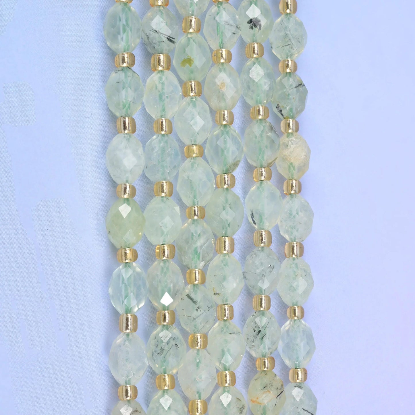 Faceted rice barrel cut light green prehnite beads