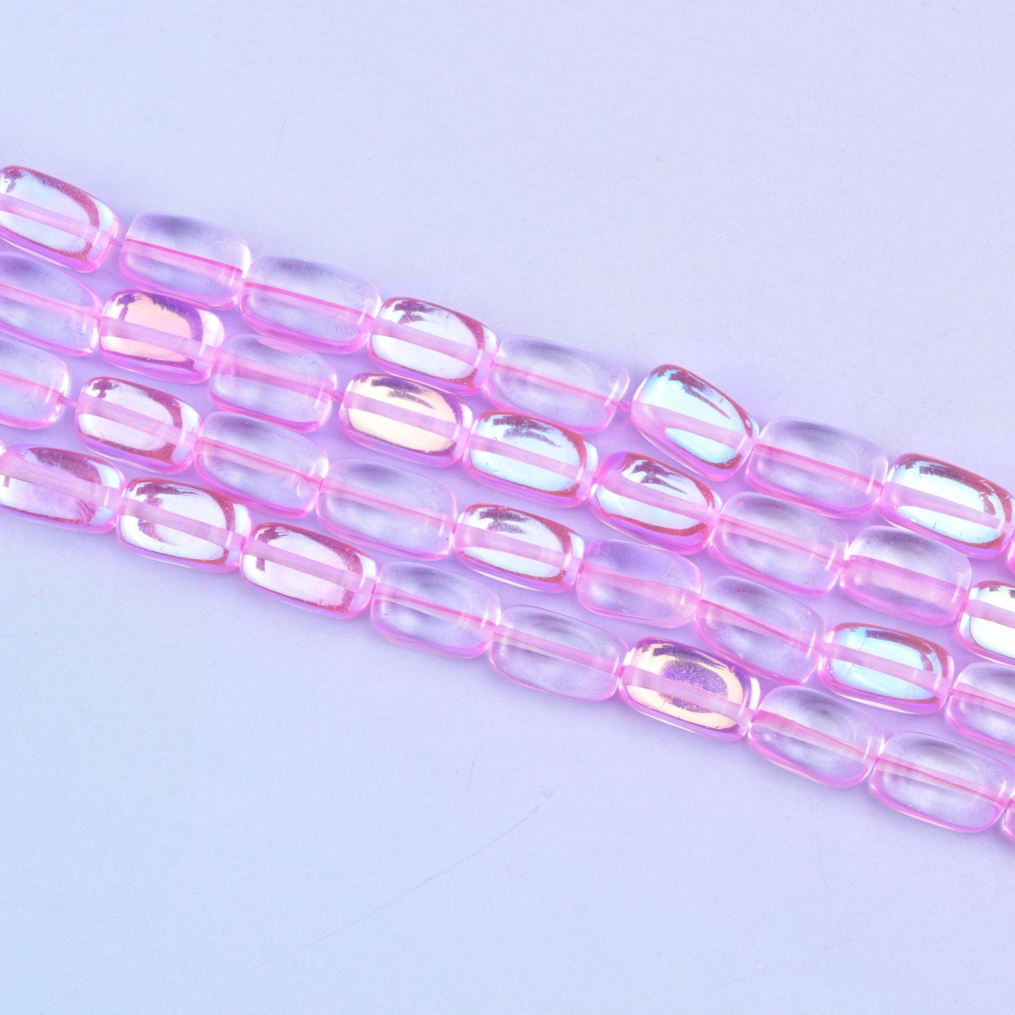 Pink mystic aura beads in vivid bubblegum-pink with a subtle iridescent glow