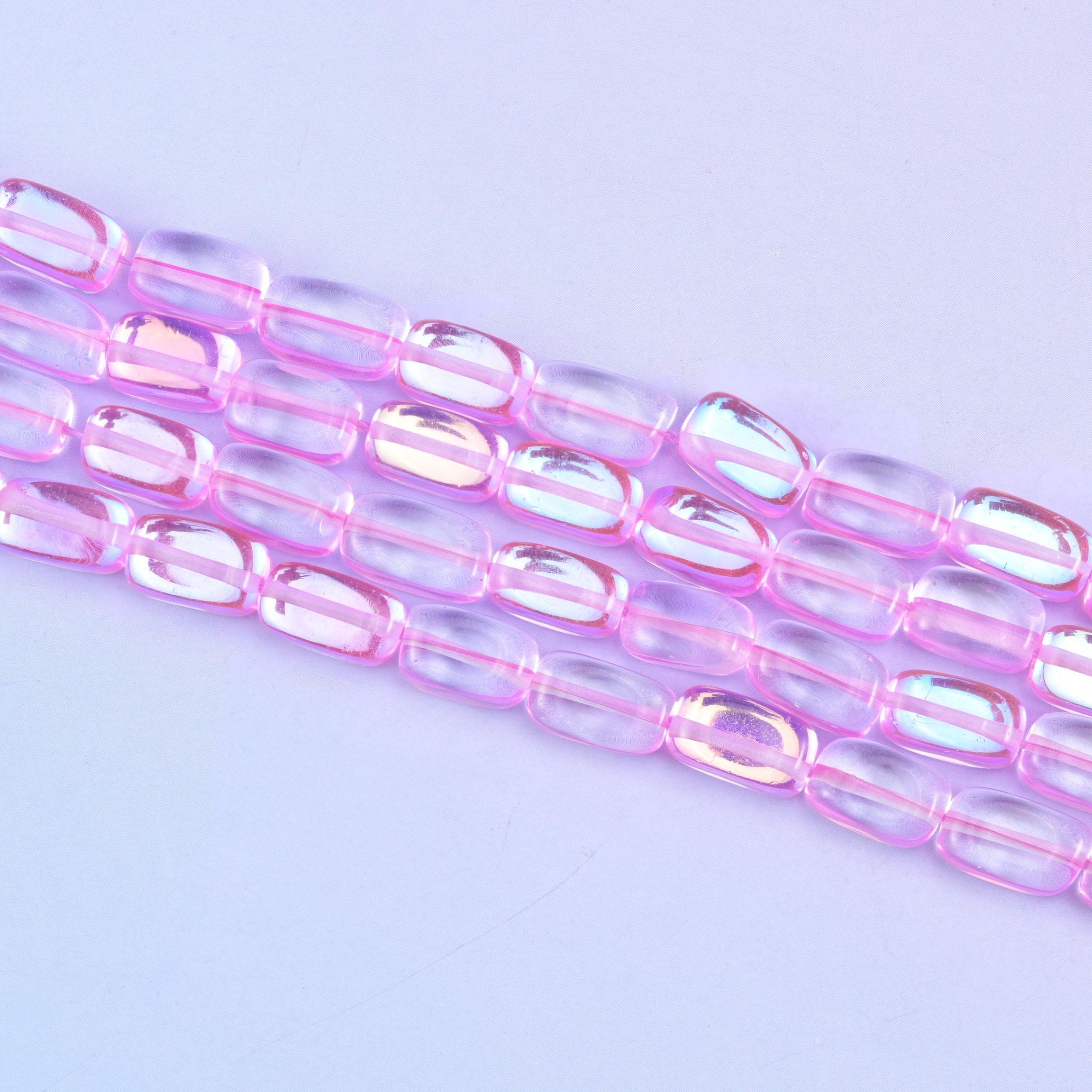Pink mystic aura beads in vivid bubblegum-pink with a subtle iridescent glow