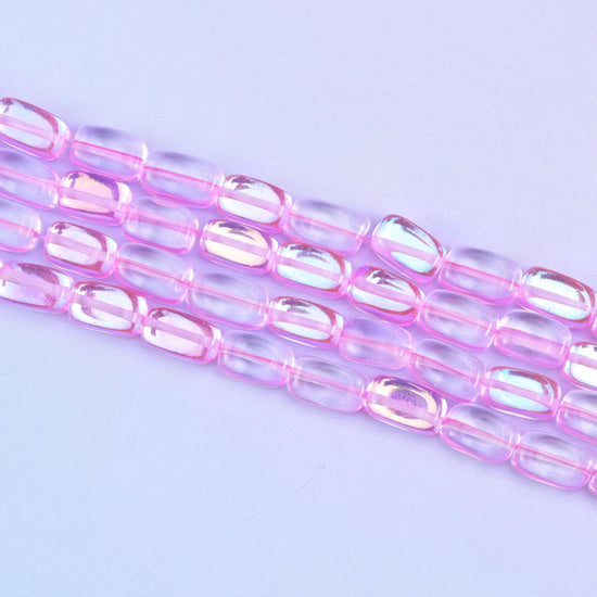Pink mystic aura beads in vivid bubblegum-pink with a subtle iridescent glow