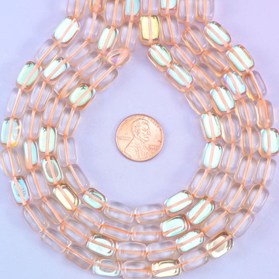 Orange Mystic Aura glass beads in a rectangular cut with a glossy transparent finish, featuring a warm amber-orange shine with a subtle iridescent glow