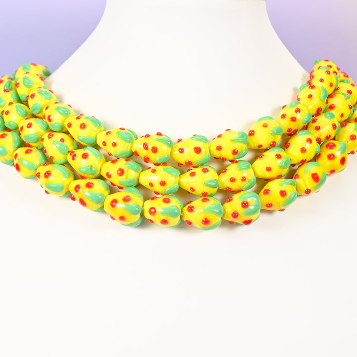 Strawberry glass beads, yellow with red dots, approximately 15.5x12mm