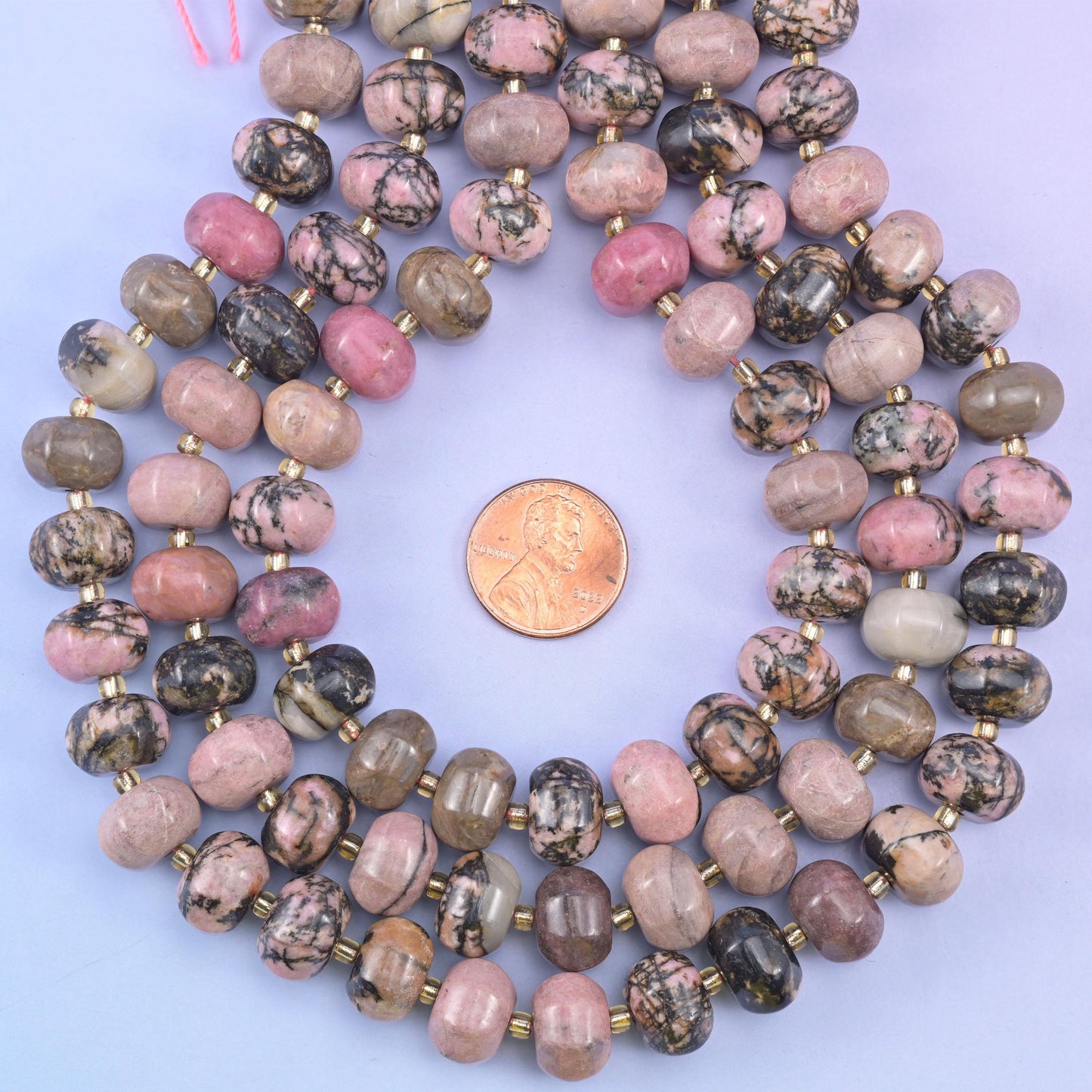 Rhodonite pumpkin beads, approximately 35 beads per strand