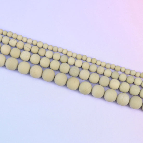 Green Alashan Agate Matte Round Beads in soft sage-olive with pale mottling