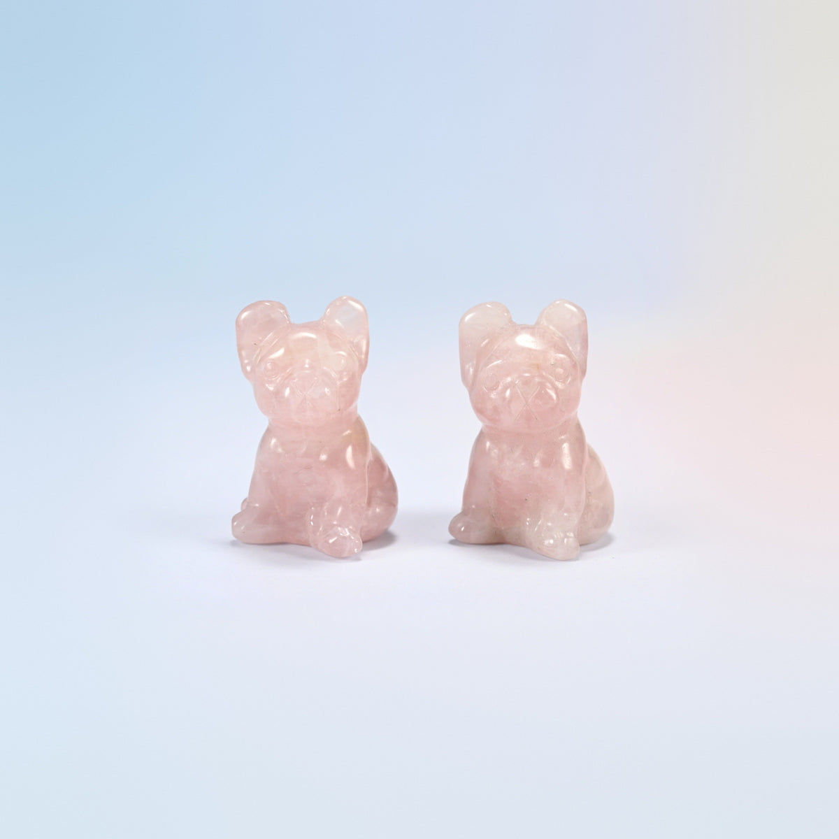 Two natural rose quartz French bulldog crystal carvings, 1.5 inch, light pink