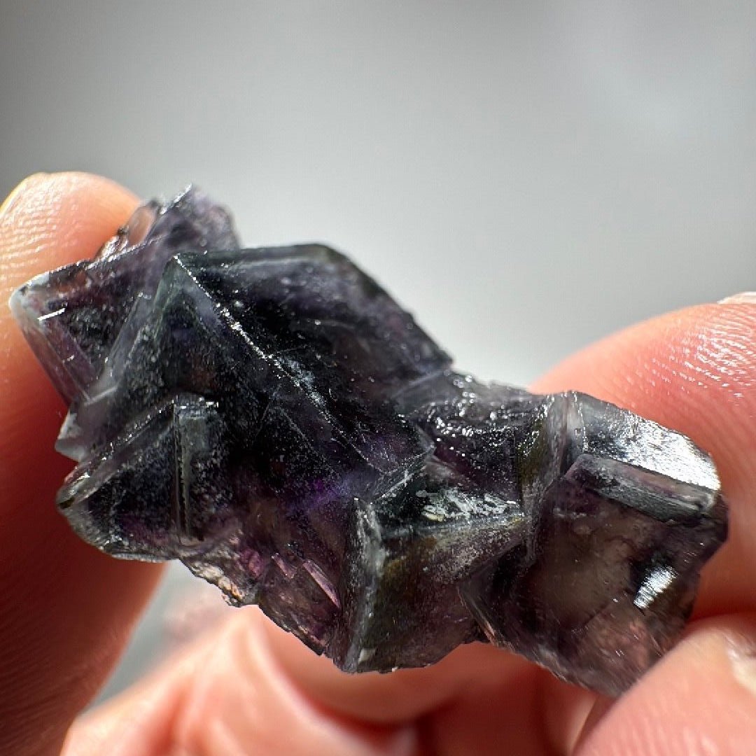 Angled view showing the sharp cube corners and the clearer purple zones between them