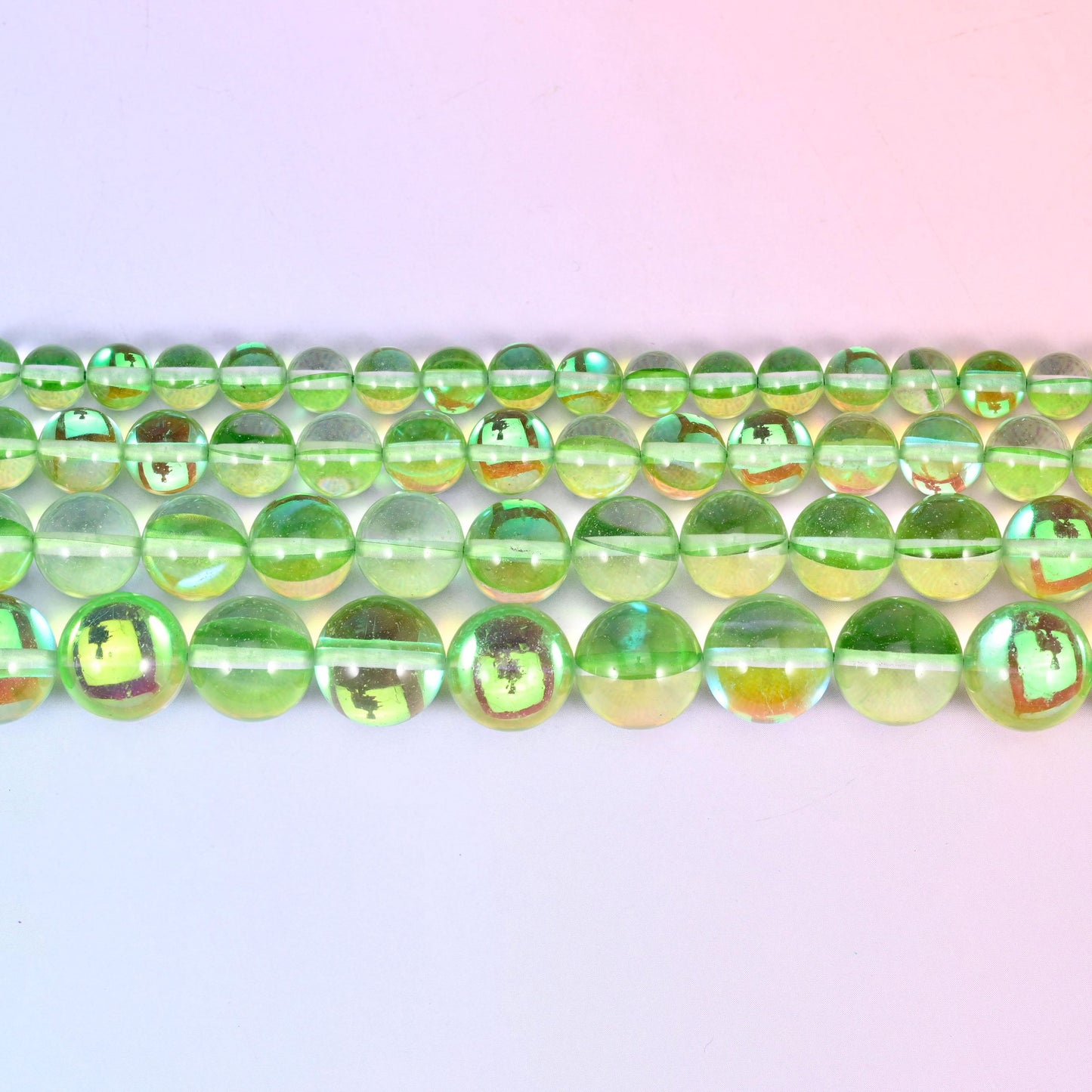Mystic Aura Light Green Round Glass Beads in bright apple-green with gold, teal and violet flashes
