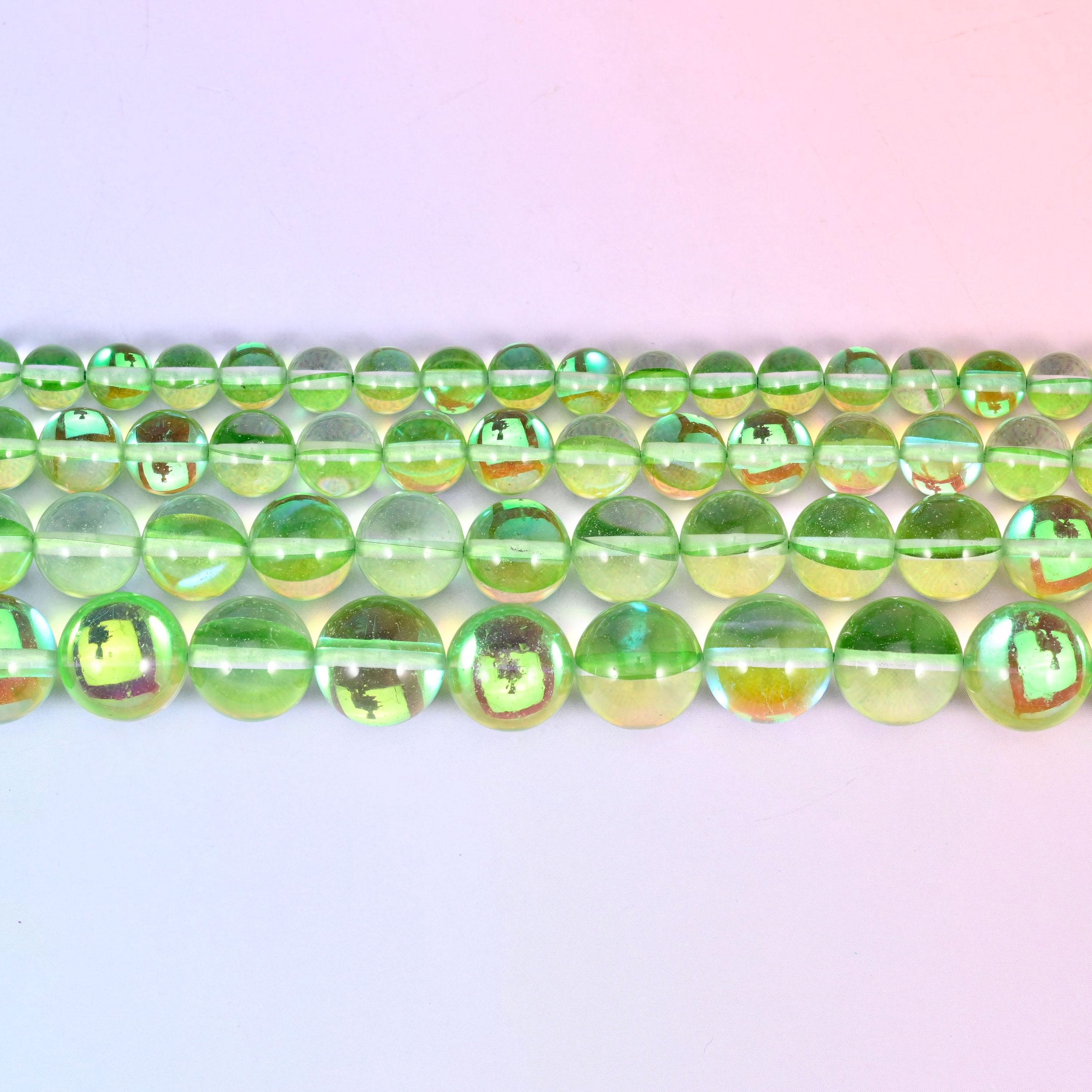 Mystic Aura Light Green Round Glass Beads in bright apple-green with gold, teal and violet flashes