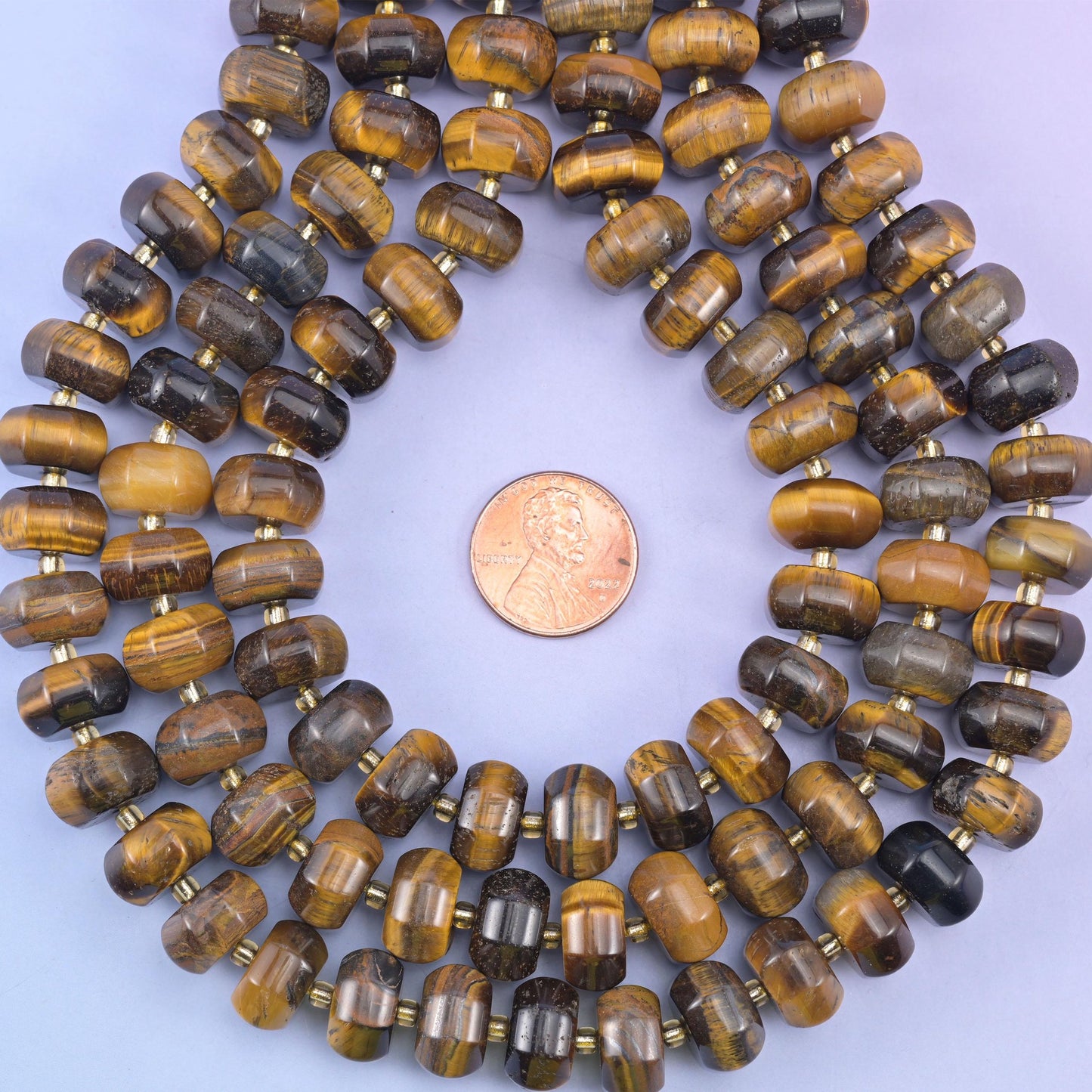 Tiger eye smooth pumpkin beads in golden-brown bands with chatoyant shimmer