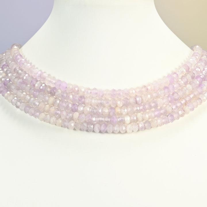 Purple Jade gemstone rondelle beads 4x6mm shown on a white neck display as a layered necklace