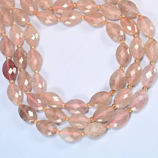 Strawberry quartz faceted flat oval beads curved into an open loop, pink beads with fine red flecks