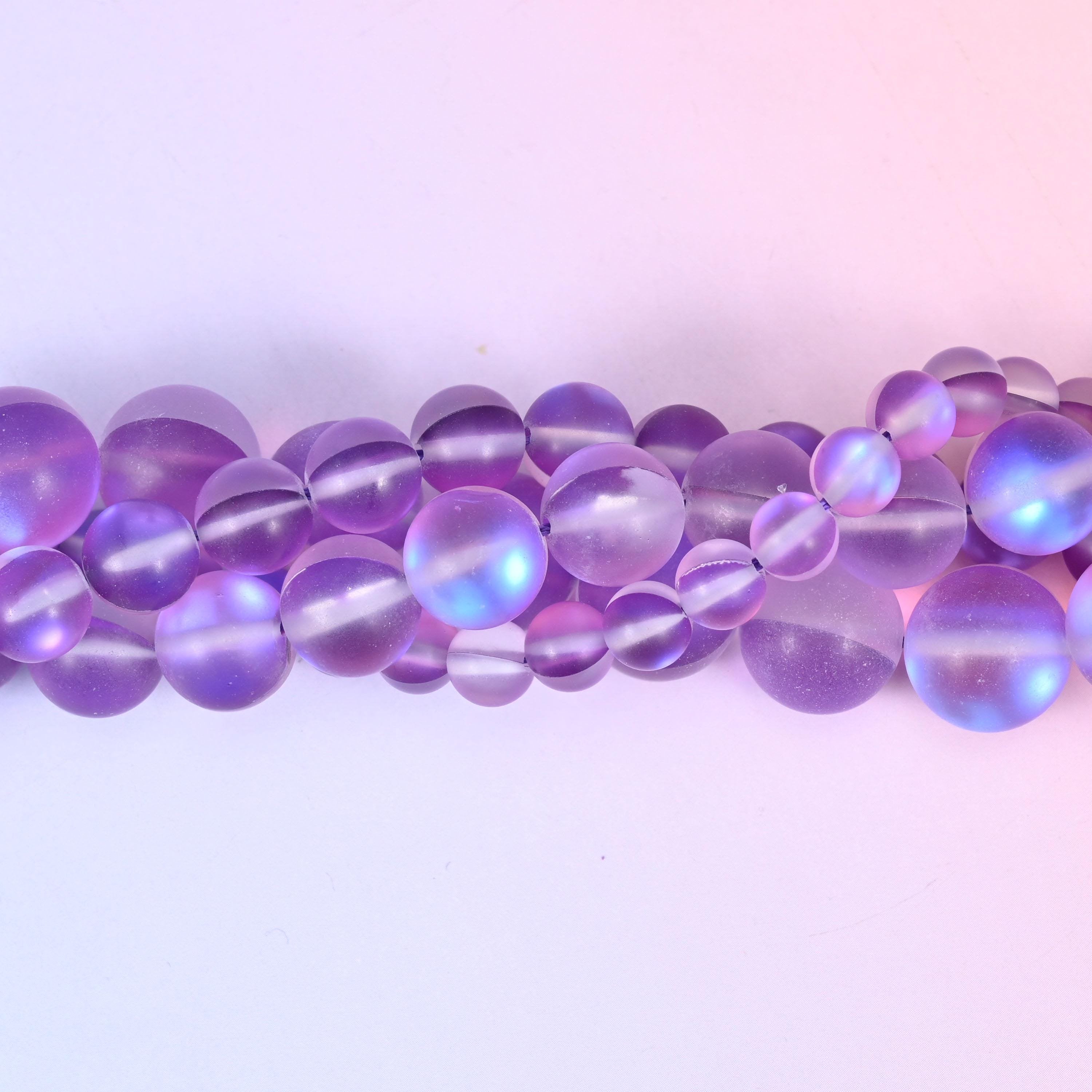Soft violet and lilac glass beads with a frosted sea-glass surface