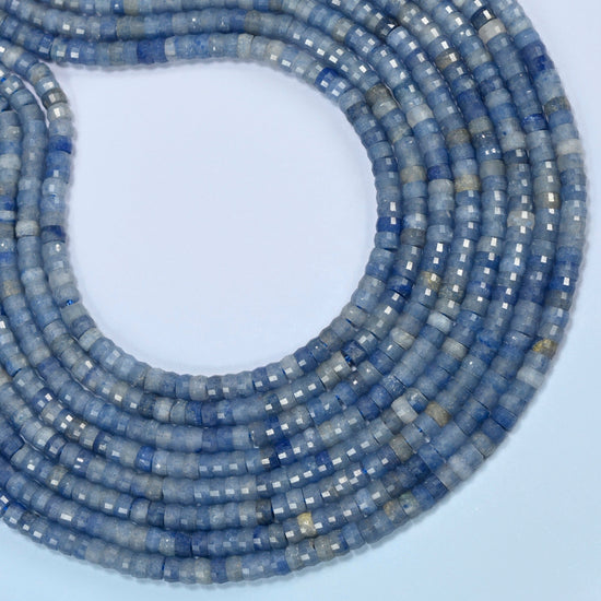 Blue aventurine faceted heishi disc beads curved into an open loop, light blue and gray-blue beads