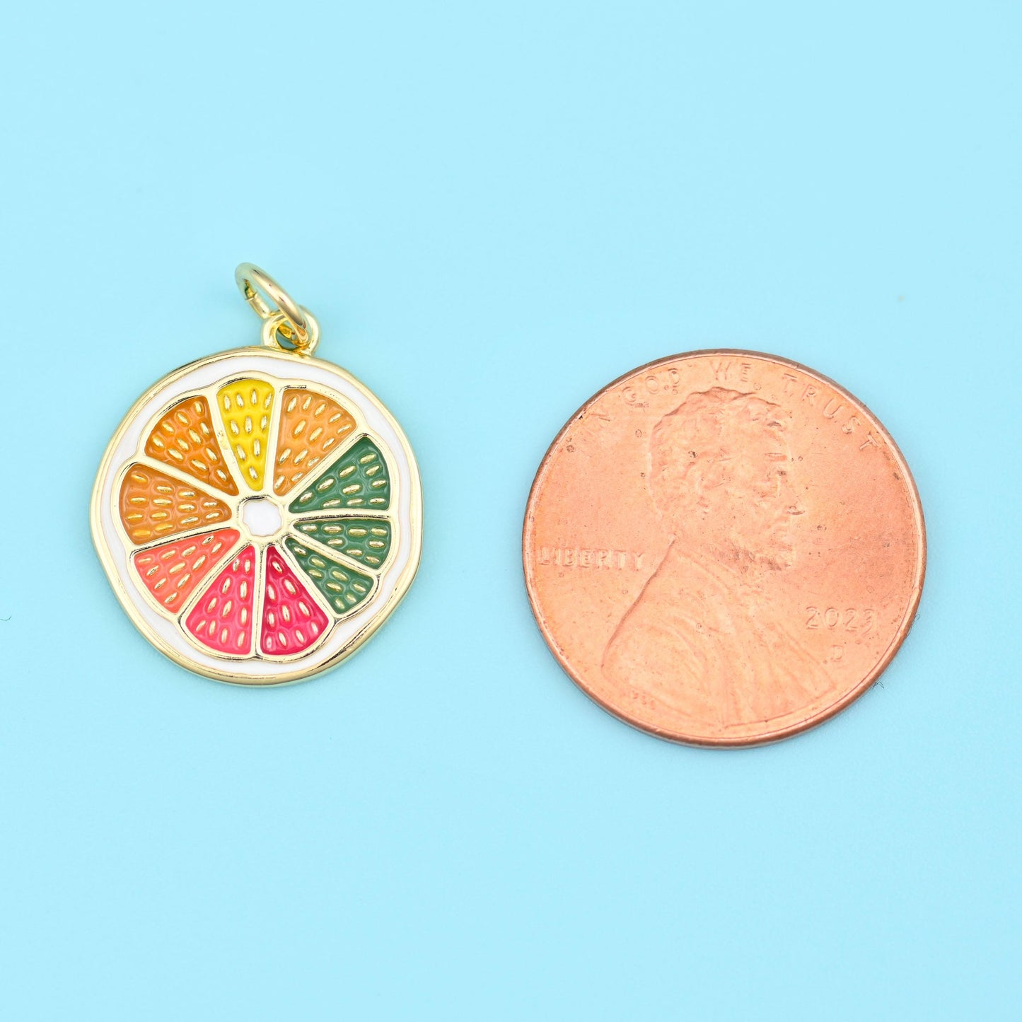 18K Gold Filled Enamel Lemon Slice Charm 18.13x15.93mm in yellow, orange, coral, pink and green enamel with a cream rind…