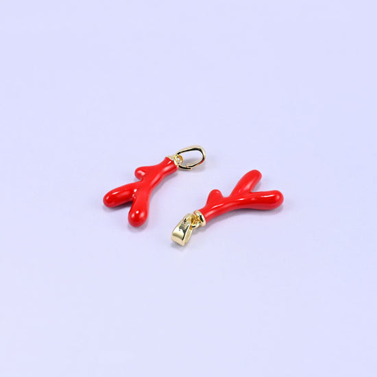 Coral branch charm with a glossy red enamel finish