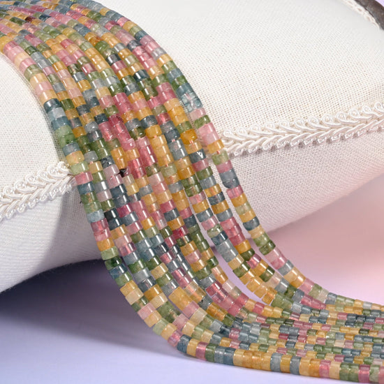 Natural Multicolor Fluorite smooth heishi disc beads in a striking mix of pink, green, golden yellow and blue-gray