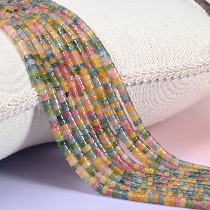 Natural Multicolor Fluorite smooth heishi disc beads in a striking mix of pink, green, golden yellow and blue-gray