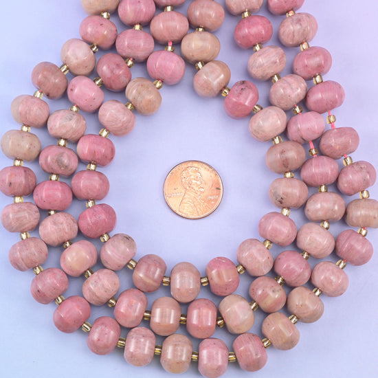 Pink rhodonite smooth pumpkin beads in warm mauve-pink with soft natural tonal shading