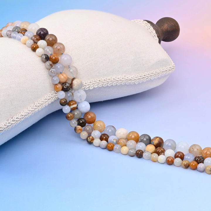 Multi-Color Chalcedony Smooth Round Beads in cream, honey brown and pale grey-blue.