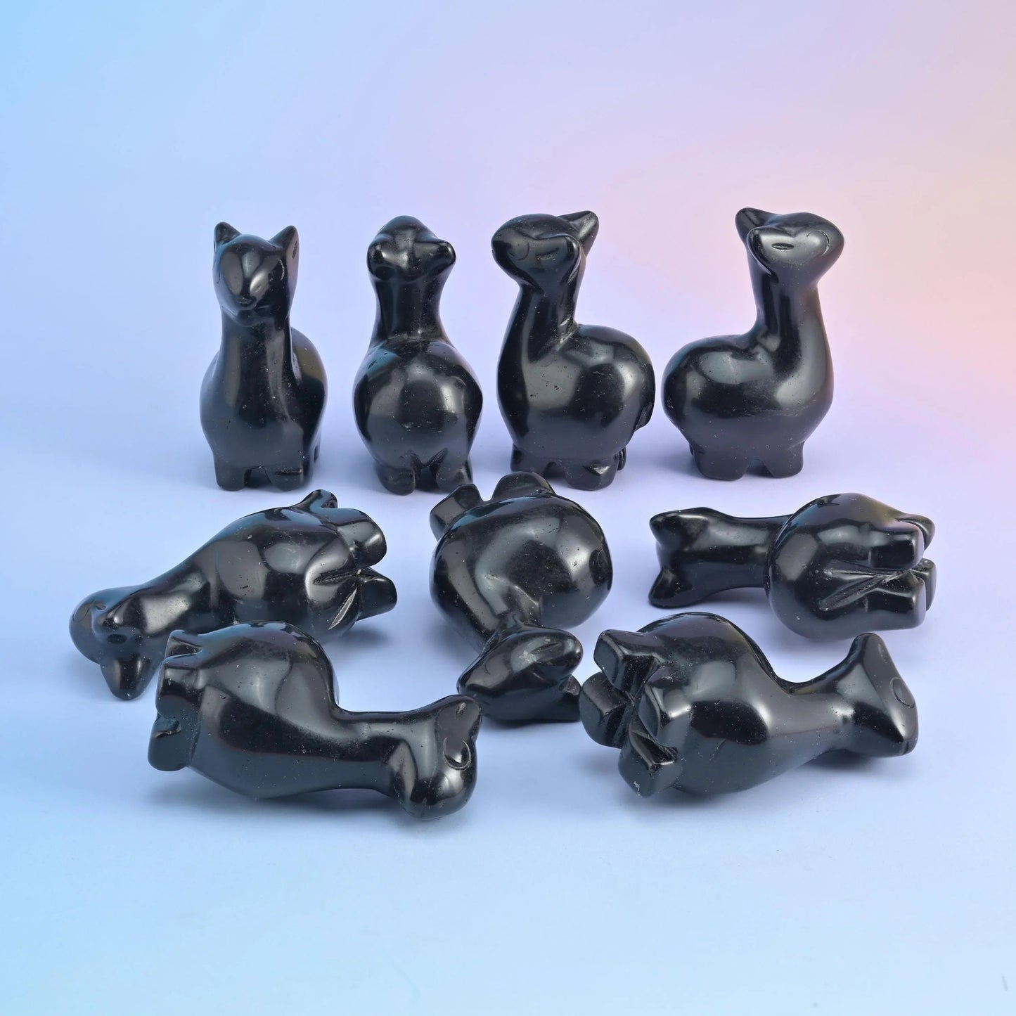 2 inch alpaca crystal carving with a long neck, tipped ears and tucked legs, polished to a high shine